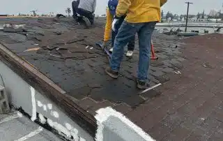 Workers fixing the roof