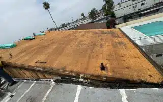 Shingle repairs to restore compromised sections of the sloped roofing.