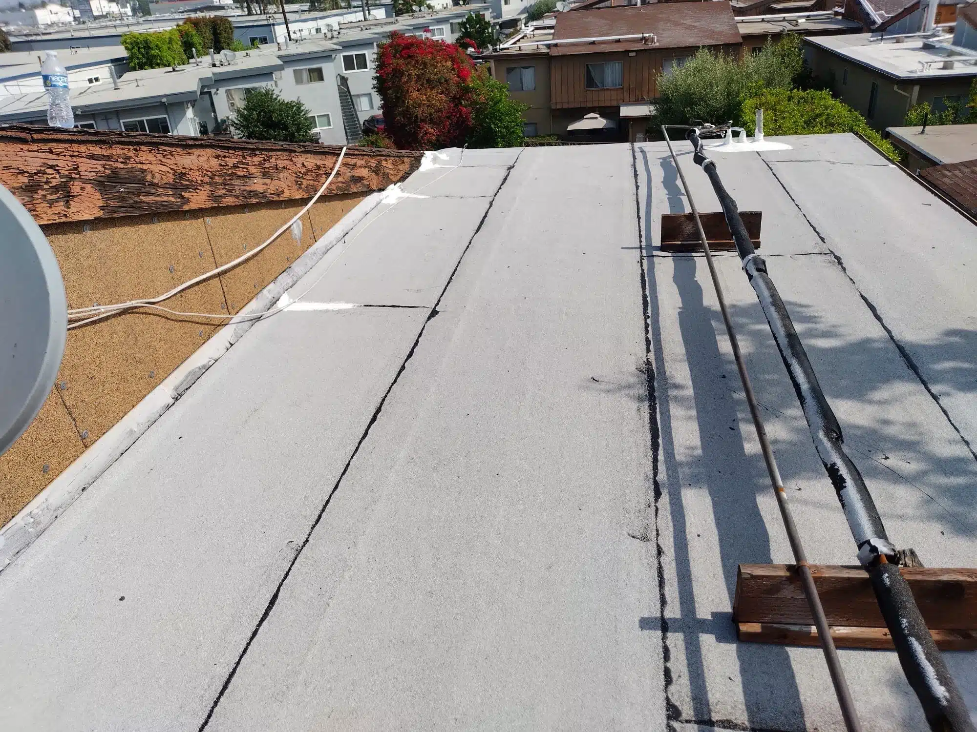 Torch down roof repairs to reinforce and waterproof affected flat roof areas.