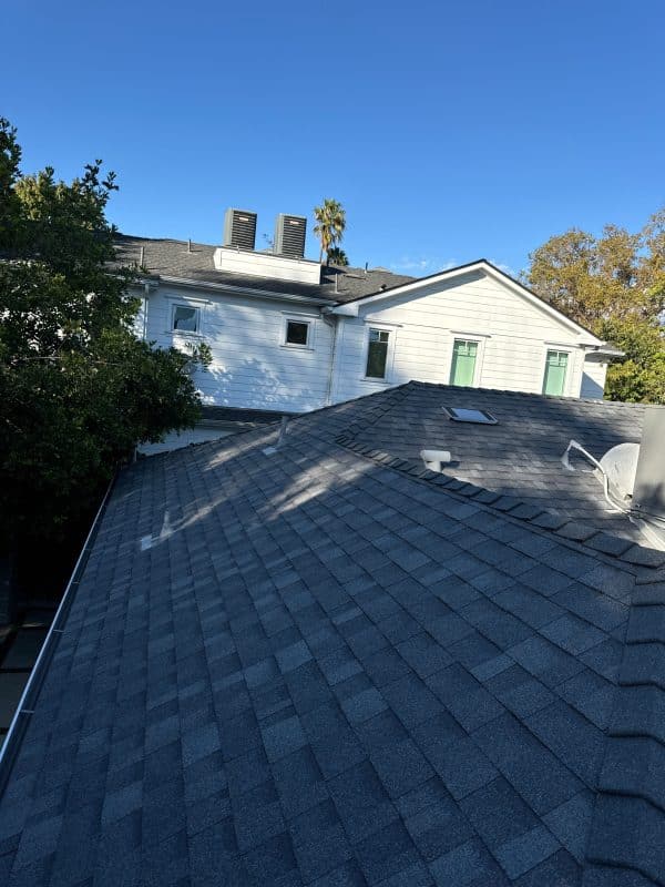 Asphalt shingle roof after shingle replacement