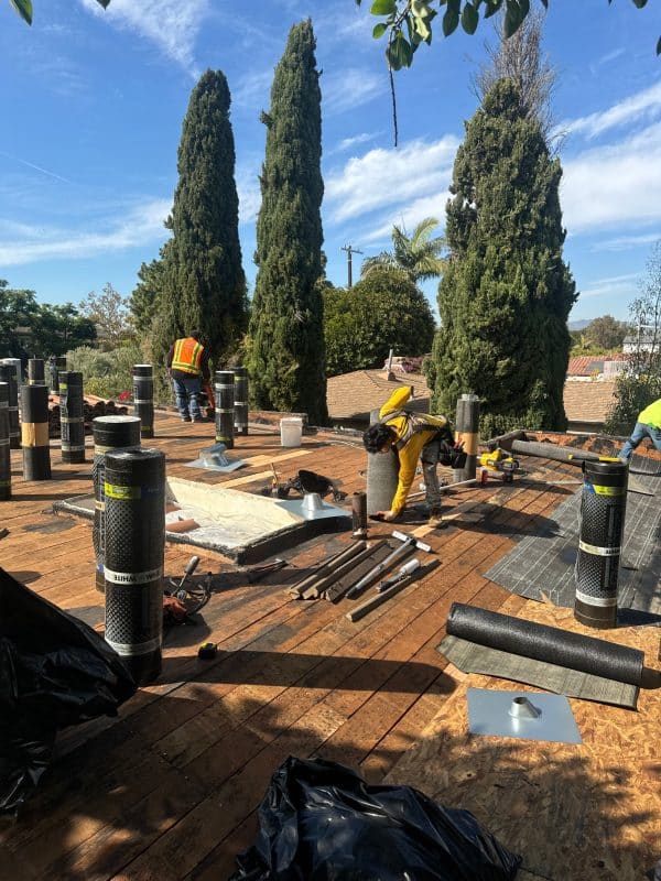 Roof flashing and underlayment materials laid out on a roof deck