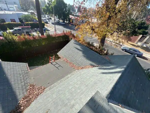 Roof valley and gutter line cleared of leaf debris