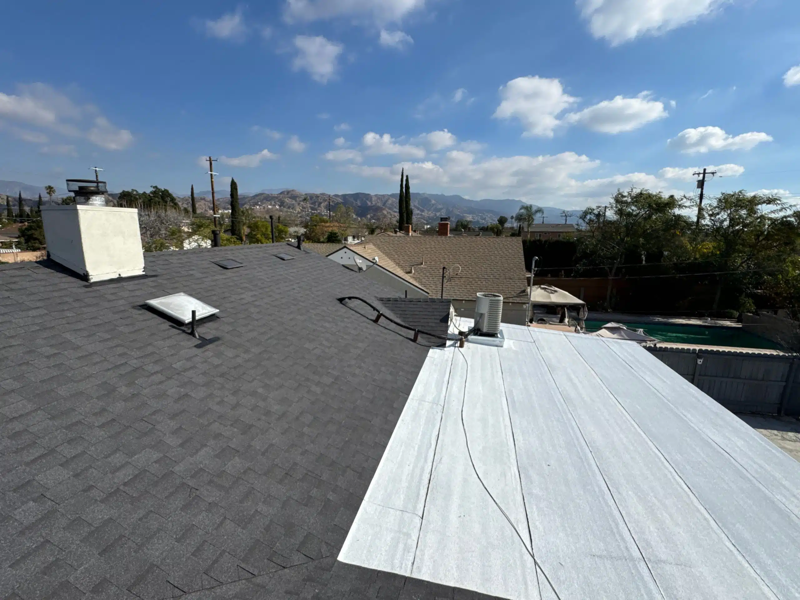 House roof with scenic mountain view.
