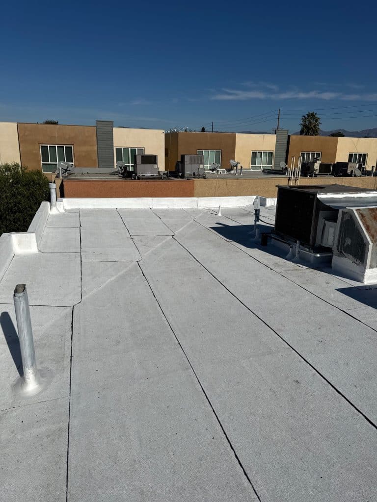 Repaired commercial flat roof membrane