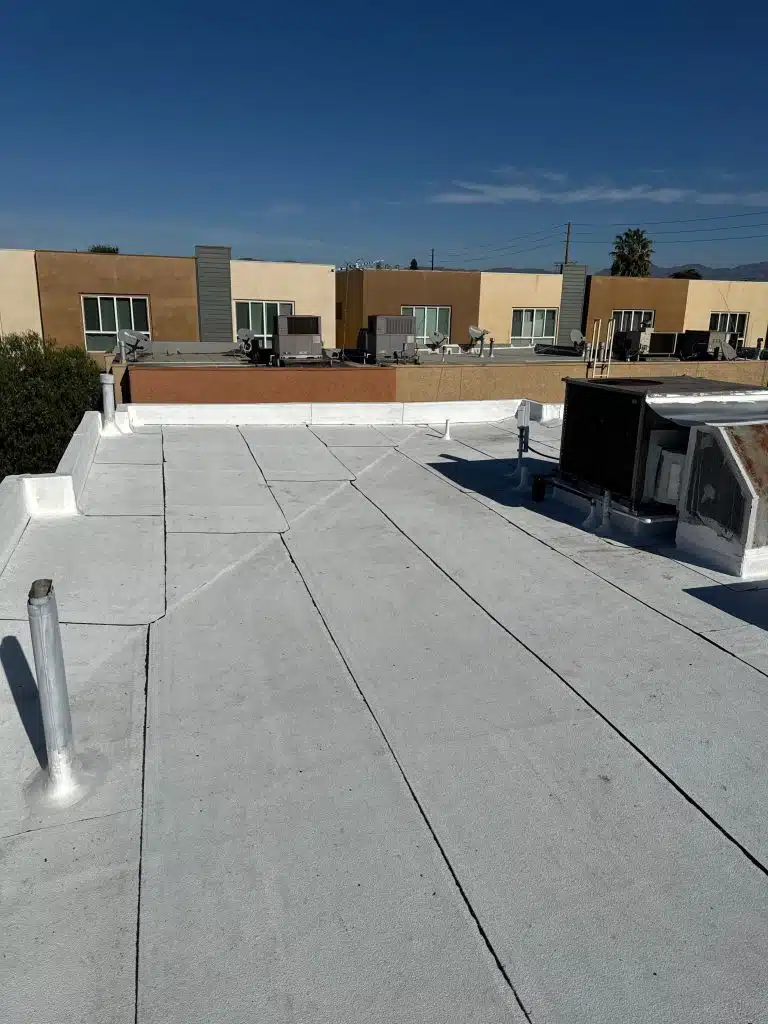 Repaired commercial flat roof membrane