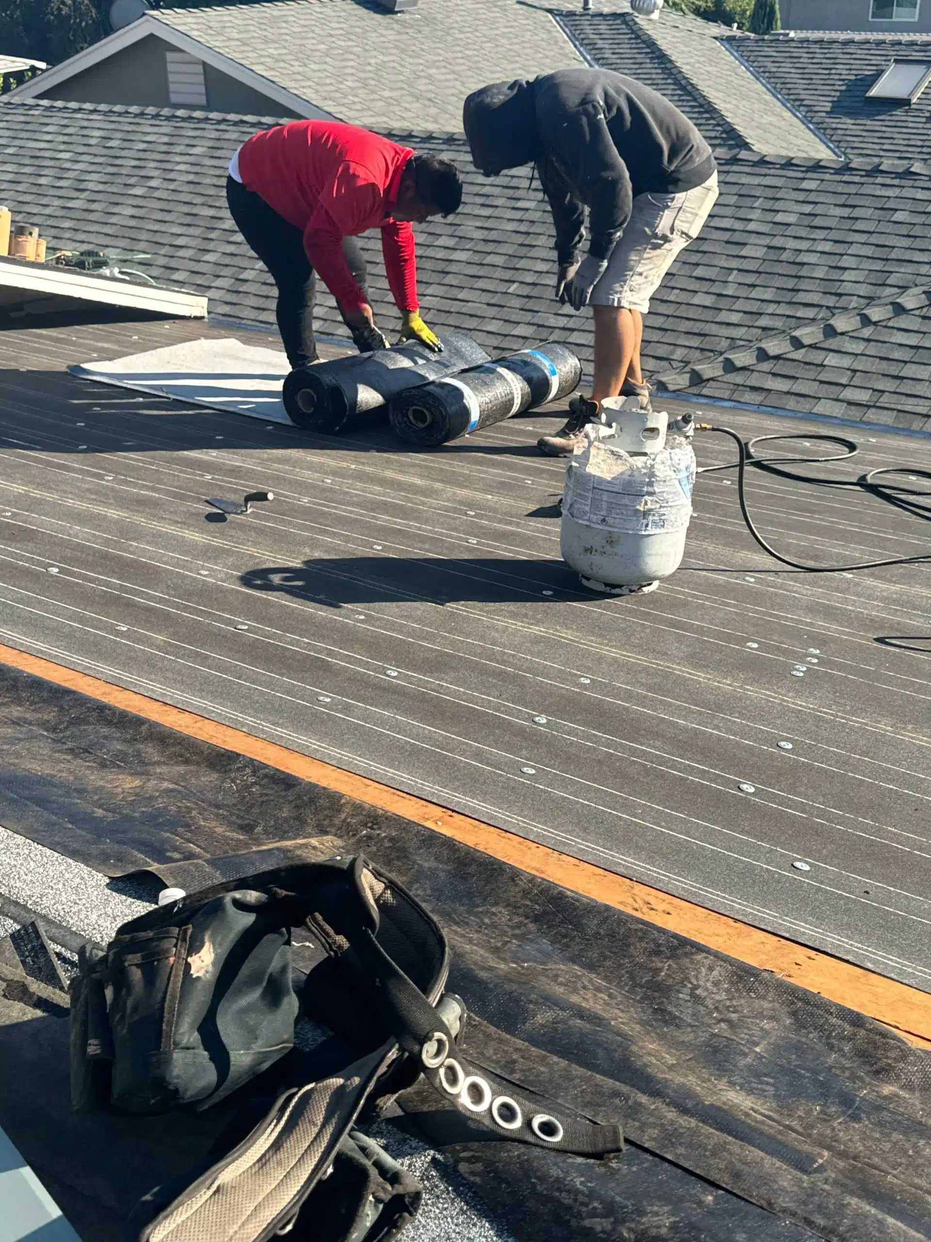 Crew safely working on sloped roof during Glendale replacement project