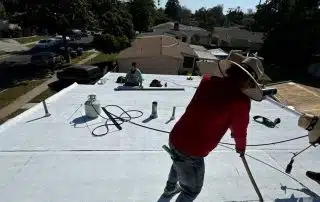 roofers completing torched down roof