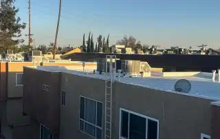 7319 Hazeltine Ave, Los Angeles, CA 91405 Rooftop view with air conditioning units and trees.