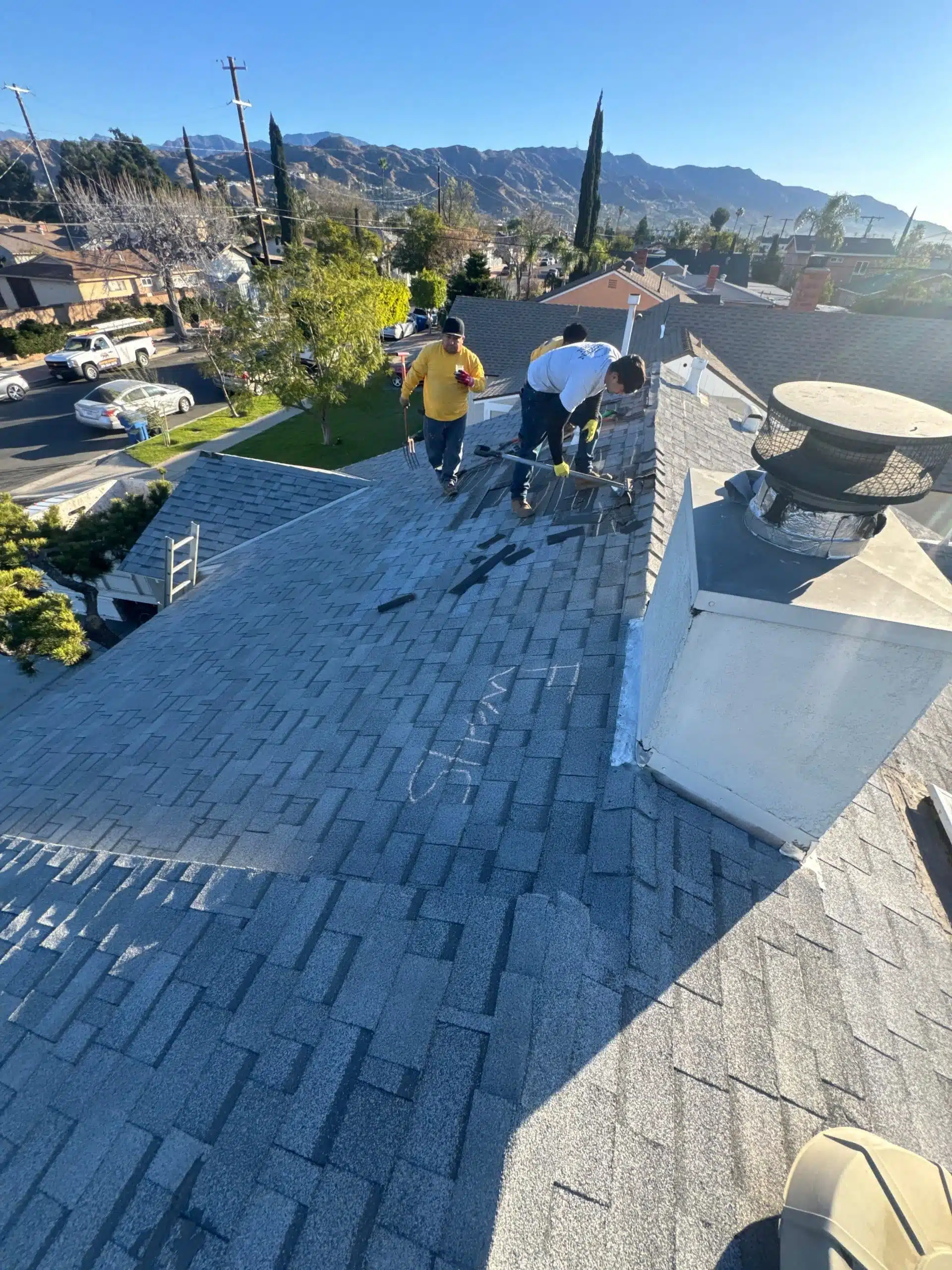 old roof shingles being removed
