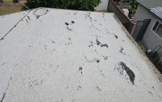 damage on torched down roof