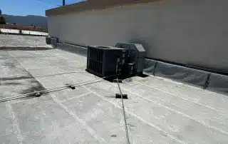 Reinforced flashing along roof edge during Burbank flat roof repair