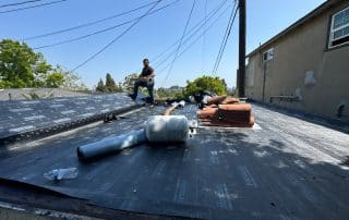 laying the underlayment down on roof