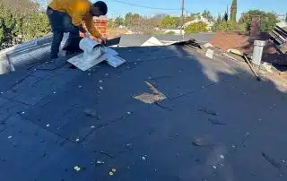 Roofers removing the old shingles
