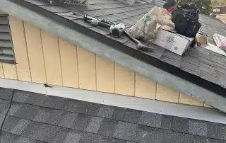 Tools and materials on rooftop, sunset background.
