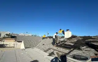 roofers removing old shingles