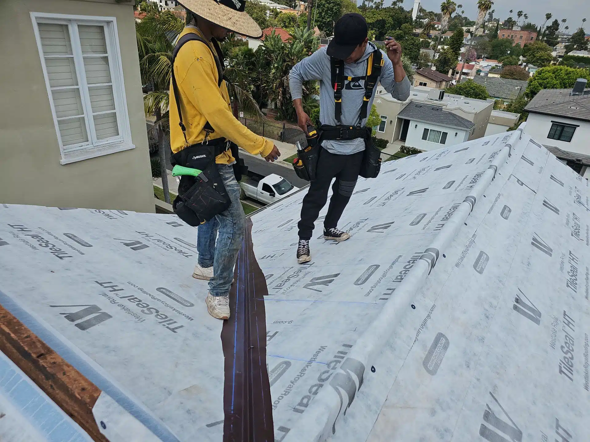 Roof workers prepping the job