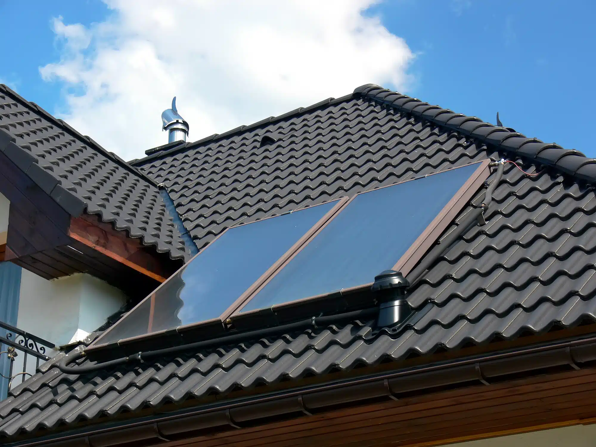 dreamstime_m_12084958 Roof with solar panels on sunny day.