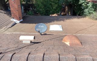 Roof with satellite dish and chimney