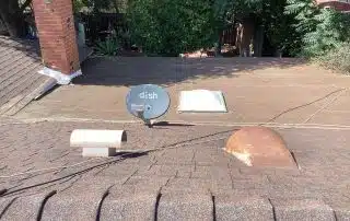 Roof with satellite dish and chimney