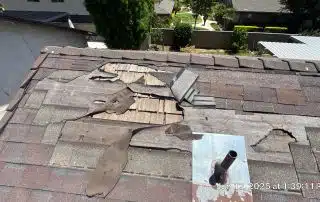 16-Jun 12 2025 01_39pm-JuiZ Damaged roof with missing shingles and holes.