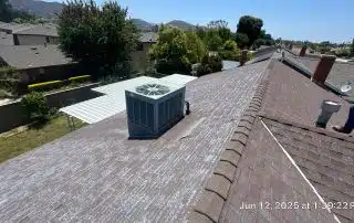 19-Jun 12 2025 01_39pm-9C7z Residential rooftop with air conditioning unit and chimney.