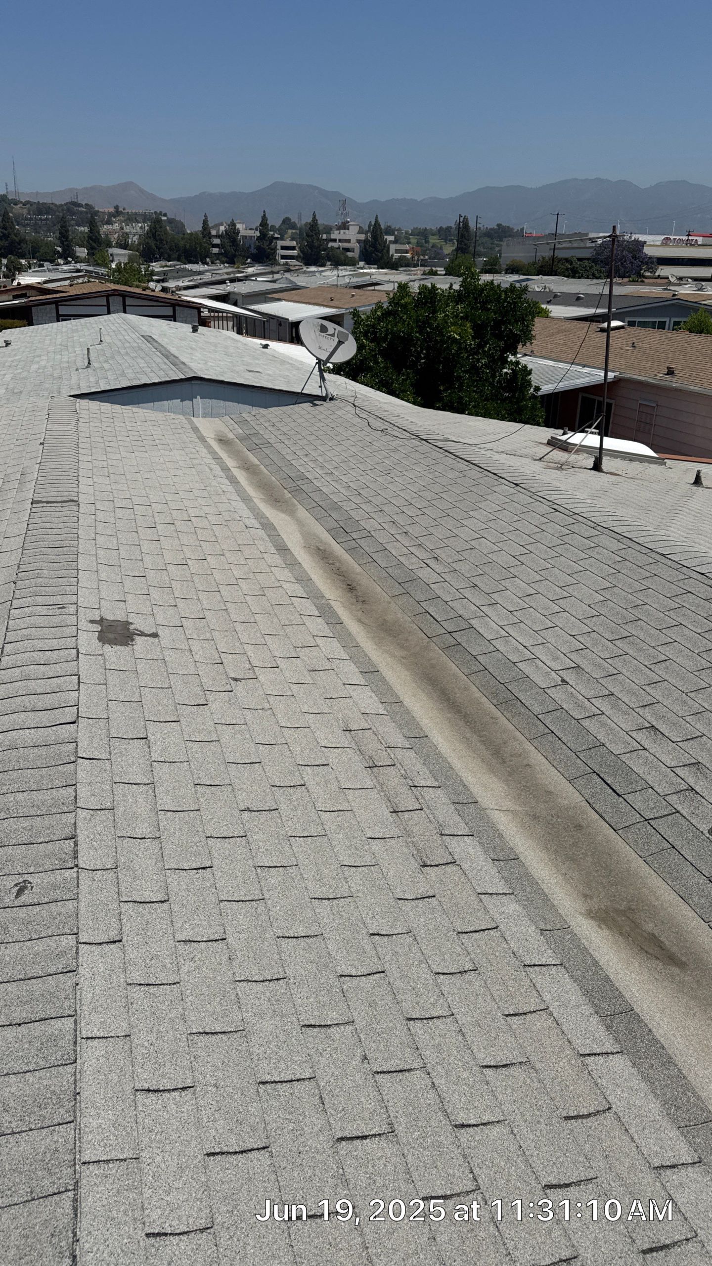 22-Jun 19 2025 11_31am-Evp4 Rooftop with satellite dish and distant mountains.