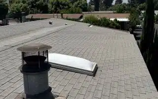 House rooftop with chimney and clear sky