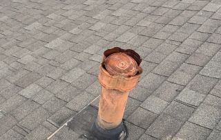 Rooftop vent pipe on shingled roof, June 2025.