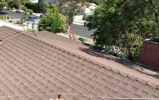Residential roof with road and trees view