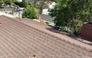 Residential roof with road and trees view