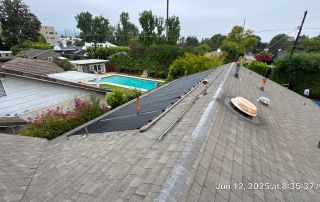 Rooftop solar panels near residential backyard pool