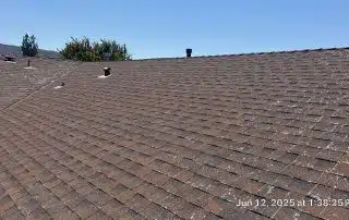 5-Jun 12 2025 01_38pm-Jmu6 Brown shingle roof under clear blue sky.