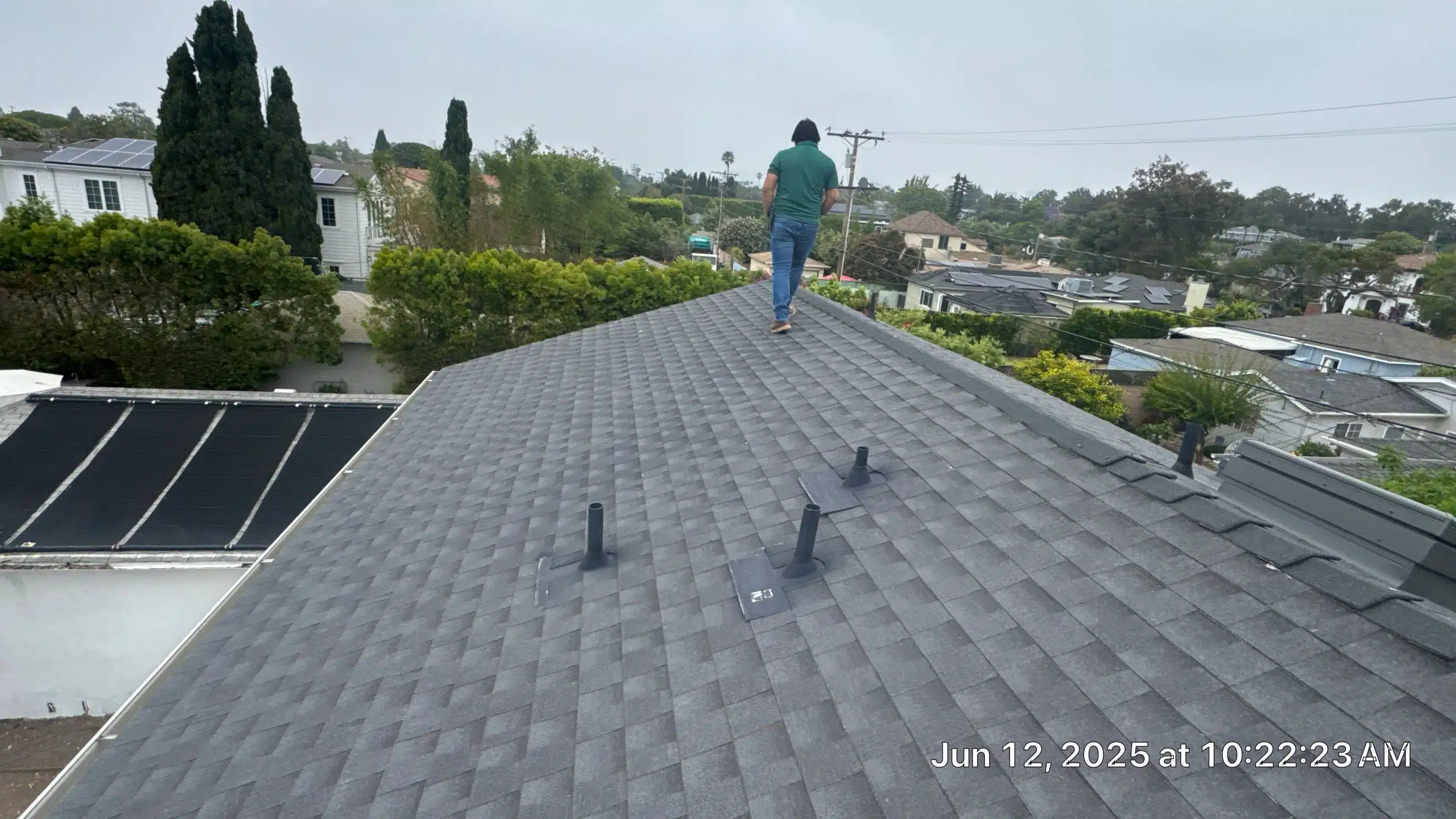 5-Jun 12 2025 10_22am-yvVY Person walking on roof with overcast sky