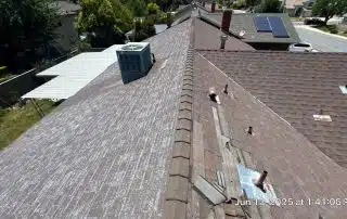 51-Jun 12 2025 01_41pm-CzWE Worn residential roof with mounted air conditioning unit.