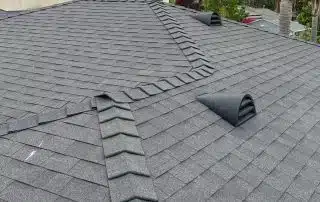 Gray shingle roof with ventilation, June 2025.