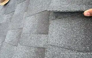 8-Jun 12 2025 10_23am-5VSR Hand lifting roof shingle for inspection.