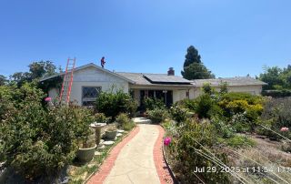 House with solar panels and garden path