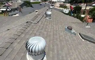 House rooftop with vents and clear sky