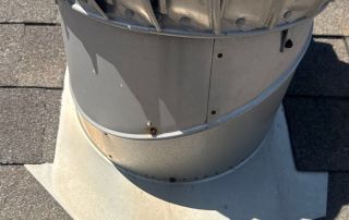 Metal ventilation turbine on rooftop.