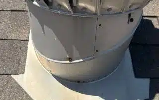 Metal ventilation turbine on rooftop.