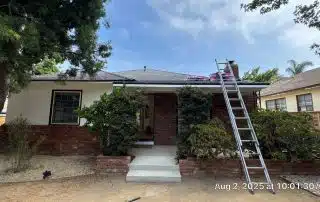 House with ladder and roof materials