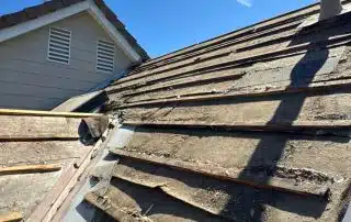 Old roof under repair in sunlight
