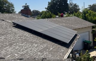 Roof with solar panels on a sunny day.
