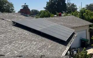 Roof with solar panels on a sunny day.