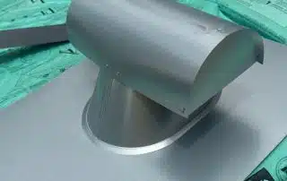 Roof vent cap on shingle packaging.