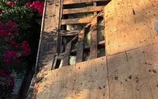 Damaged wooden roof with broken section