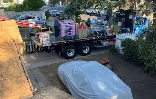 Truck with construction materials in driveway