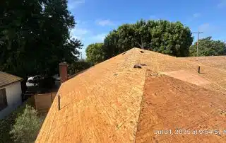 New plywood roof under construction, sunny day