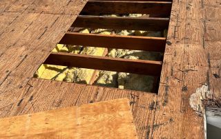 Wooden roof deck with opening under repair