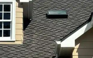 House roof with skylight and clouds